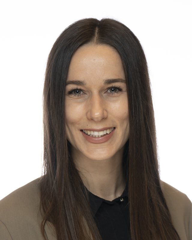 Corporate headshot on a white backdrop, shot at a Fate Media Creative booth